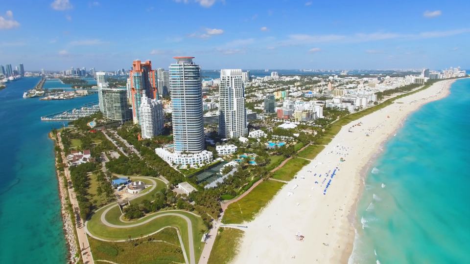 Aerial view over South Pointe Park and the South of Fifth towers, Miami Beach, looking north along the shoreline.